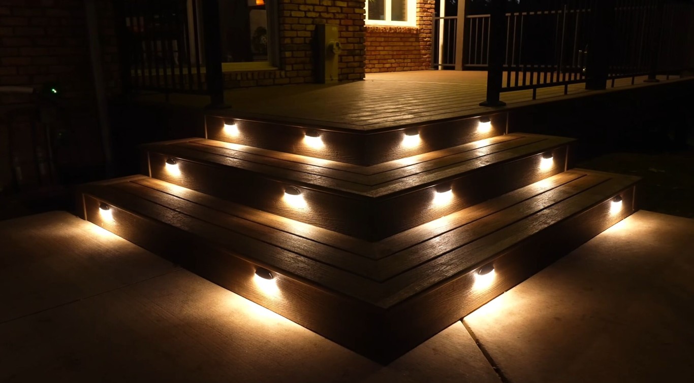 Beautiful illuminated deck stairs at night showing professional deck lighting installation in Pharr, TX